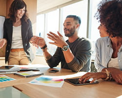 Person talking with two others
