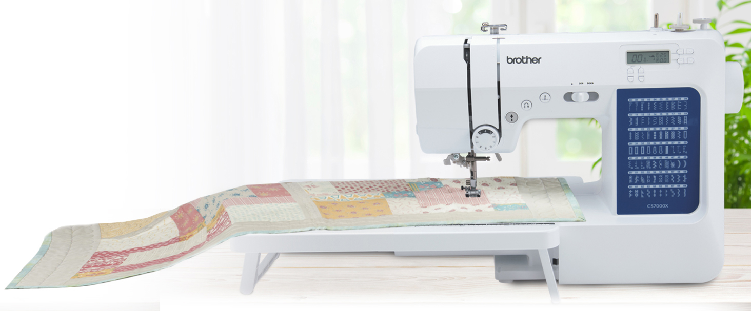 Brother CS7000X Computerized Sewing and Quilting Machine, 70 Built-in  Stitches, LCD Display, Wide Table, 10 Included Feet, White