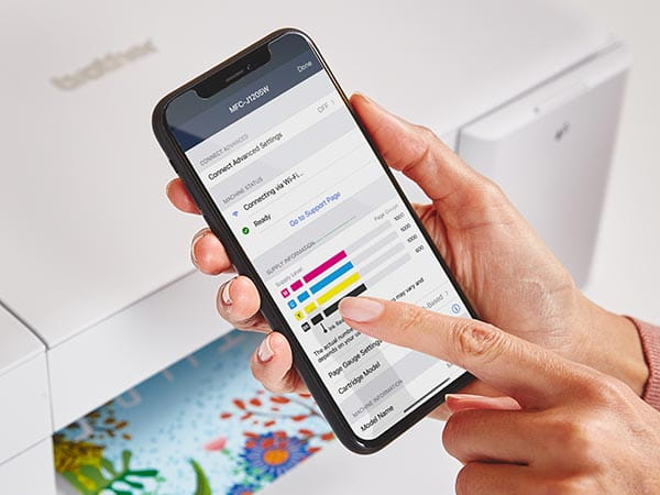 Person using mobile app on smartphone to check printer's current ink levels with Page Gauge