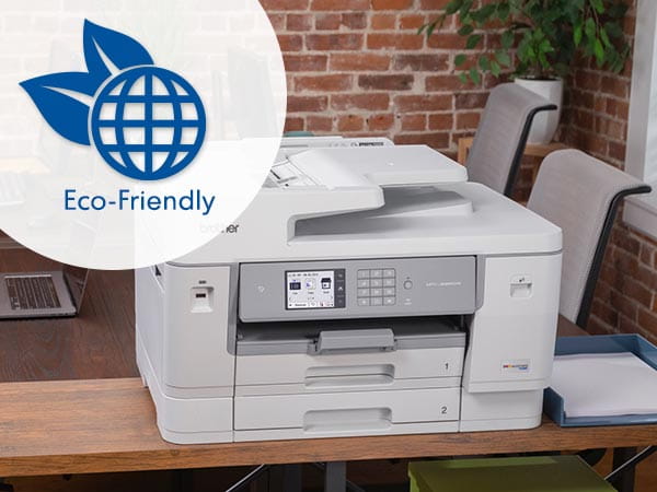 Printer on home office desk with globe icon and text reading Eco-Friendly