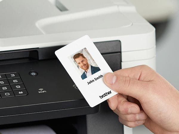 Man using ID card with NFC touch-to-connect to release print job from printer