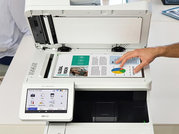 Person placing document on printer's scan glass