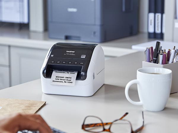 Label printer on desk printing multiple return address labels