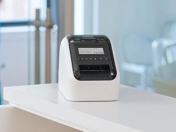Label printer on reception desk in medical office