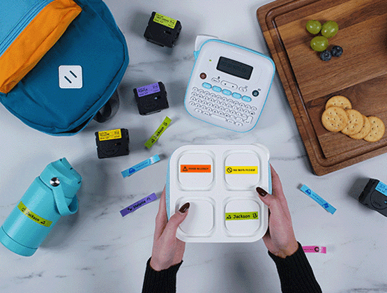 BTAG label maker and colorful name labels used on school supplies, lunchbox, and water bottle.
