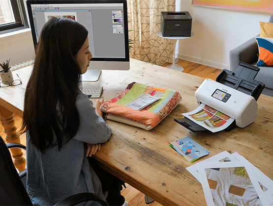 Woman using a Brother Scanner in home office