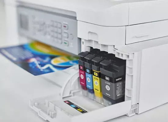 Brother Printer with open ink tank showing cartridges.