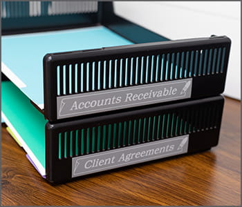 File folders stored in tray with P-touch labels affixed