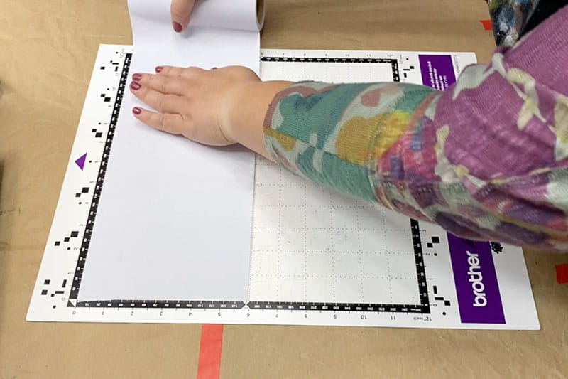 Folding masking paper on mat