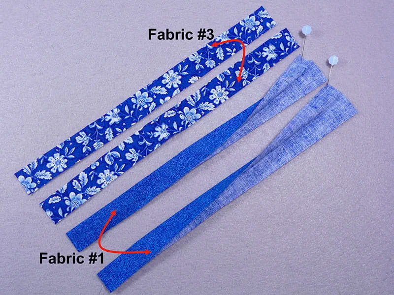 Side by side view of 4 strips of fabric with arrows displaying that 2 of them are fabric3 and 2 of them are frabric1