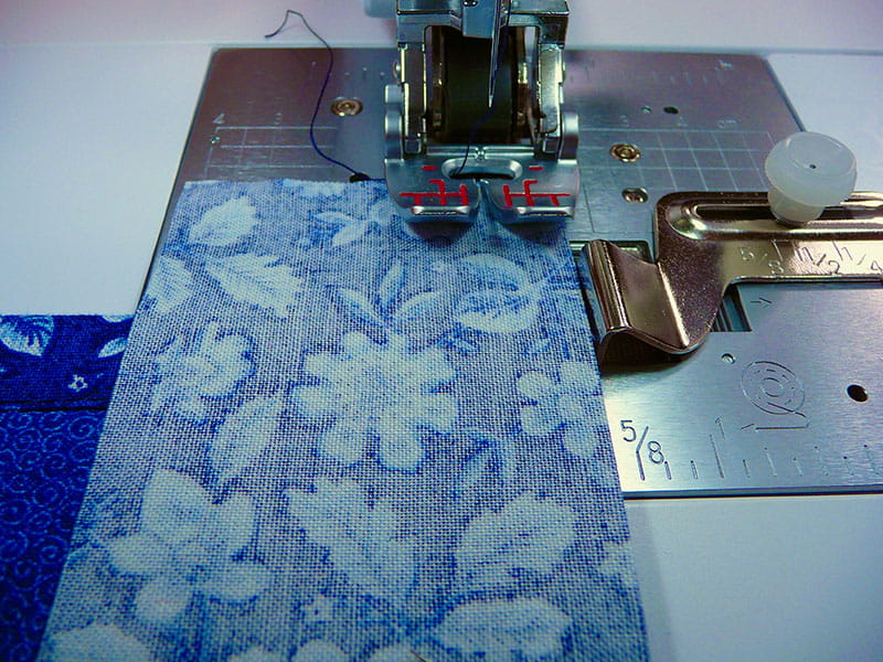 Sewing machine sewing the back of the fabric