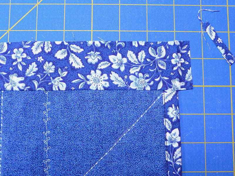 Sewn together fabric with one edge on top