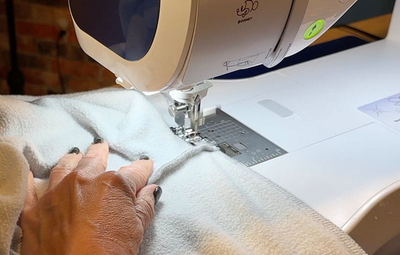 Embroidery machine light on grey sweatshirt