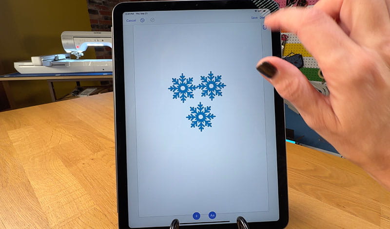 Three blue snowflakes on iPad screen