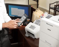 Person Printing from mobile device - brother printer in the background