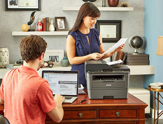 Man and Woman Working in Home Office