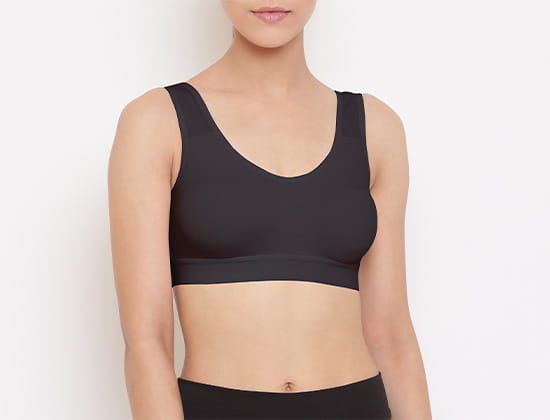 Woman in sports bra demonstrating smooth seams from bonding machines
