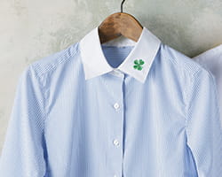 Button down dress shirt with embroidered four leaf clover on collar