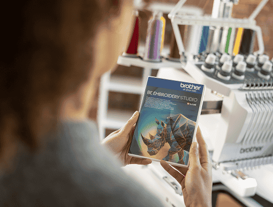 Person holding a PR1060W BE1 Software from Brother