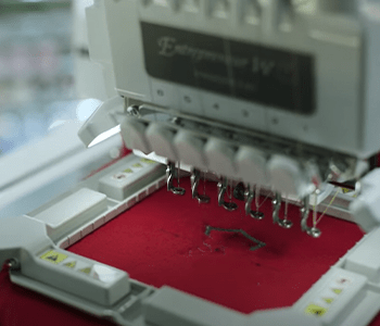 PR680W embroidering a red shirt in hoop