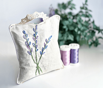 Satchel with lavender embroidery design. 