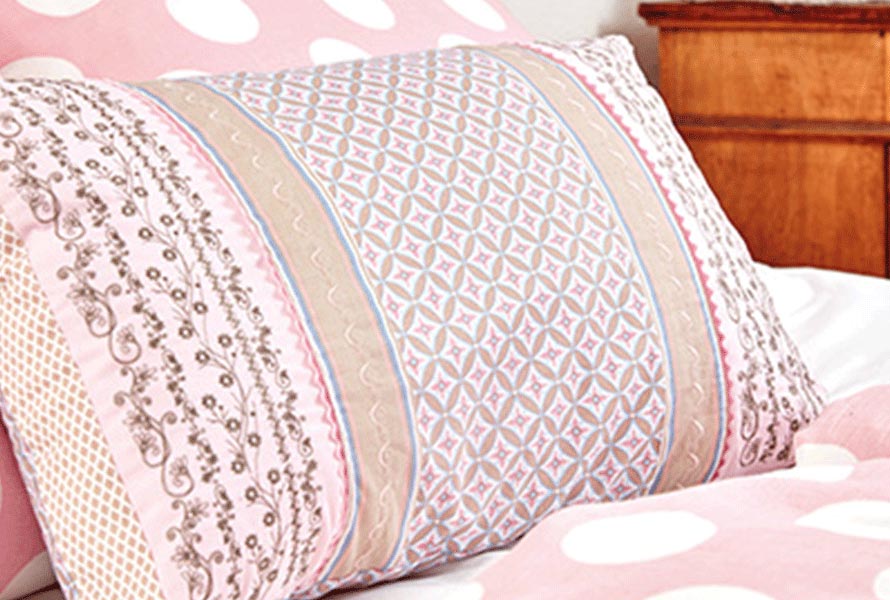Pillow with quilt designs