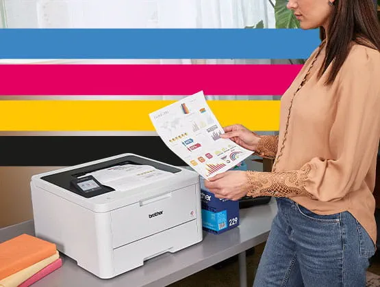 Woman in an office space printing on a Brother digital color laser printer. 