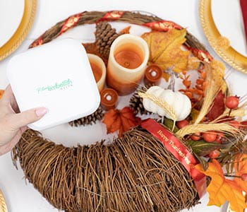 Ptouch Embellish label maker in front of cornucopia centerpiece. 