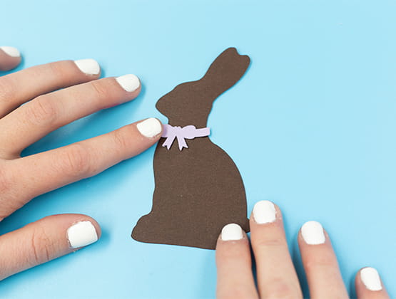 P-touch Embellish Easter Basket project step 8 affixing purple bow to bunny