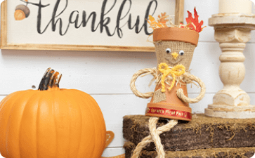 Fall terracotta scarecrow figure