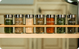 Labeled spice jars on rack