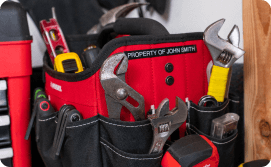 Wrenches and a level in a tool bag