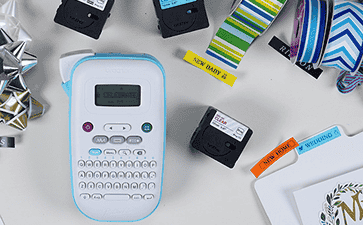 Brother Ptouch with Label Tape and Gift wrapping equipment around