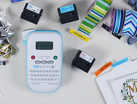 Brother Ptouch with Label Tape and Gift wrapping equipment around