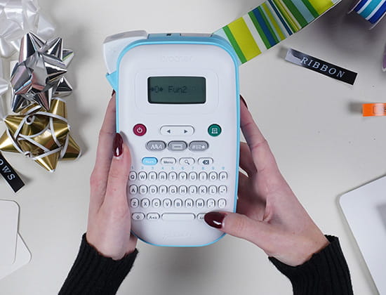 Person Typing on a Brother Ptouch