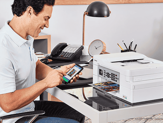 A person using Brother Mobile Connect phone app with their brother Printer 