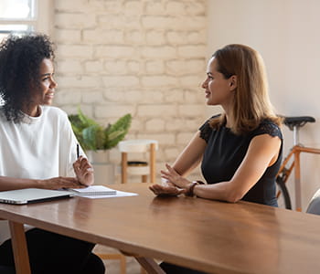 Woman consulting person about their finances