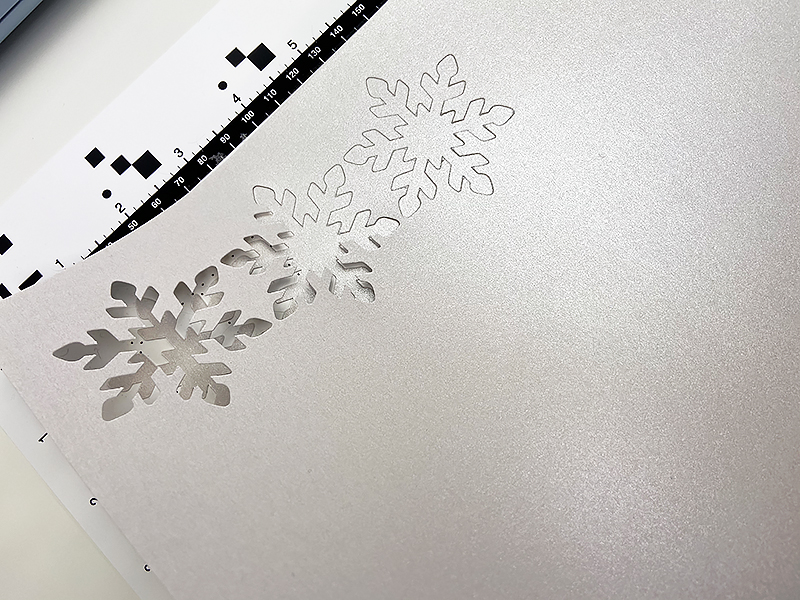 white snowflake cutouts