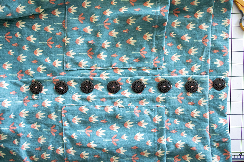 Final buttons stitched