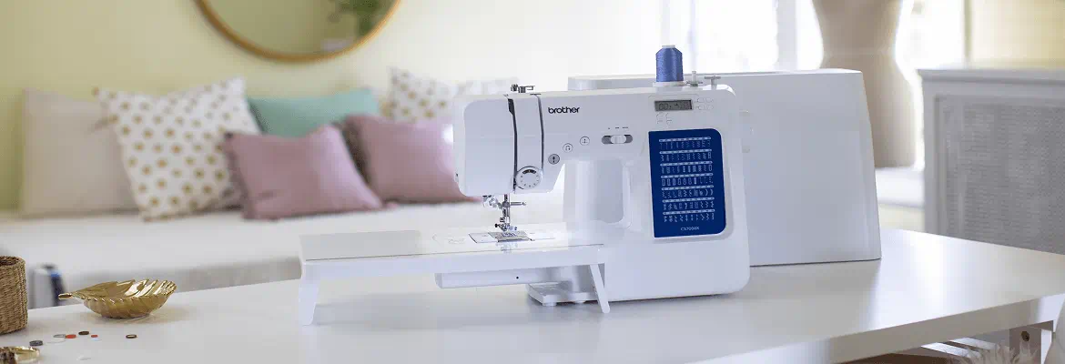 Artspira, Import your own designs and transfer wirelessly, photo showing phone connecting to sewing machine