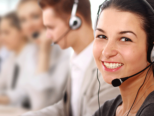 Smiling workers with headsets