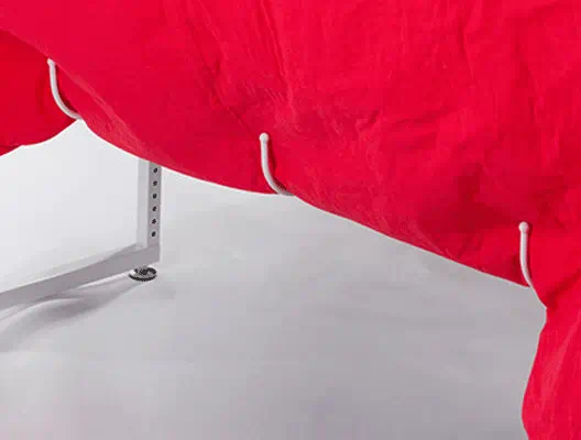 Five big hooks underneath THE Dream Fabric Frame keep excess fabric off the floor and out of your way