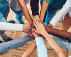 All in hands in a circle