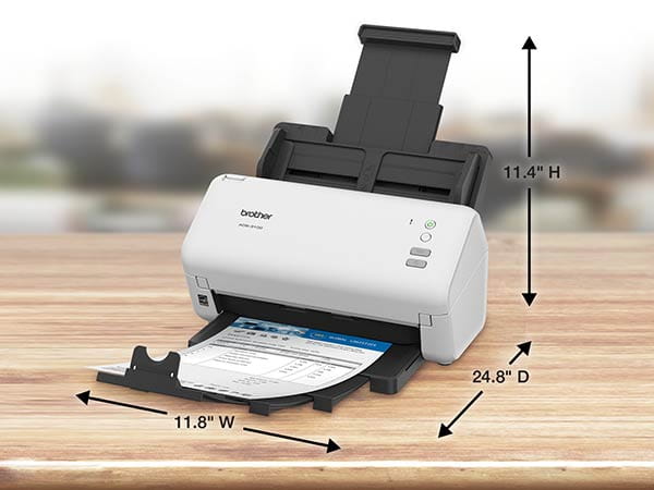 Scanner on desk with auto document feed and output tray fully extended. Fully extended dimensions: 11.8