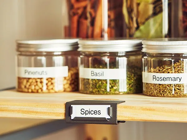 Kitchen cabinet with spices in labeled jars