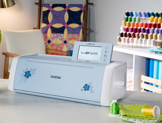 ScanNCut DX SDX325 on table with sewing thread stand