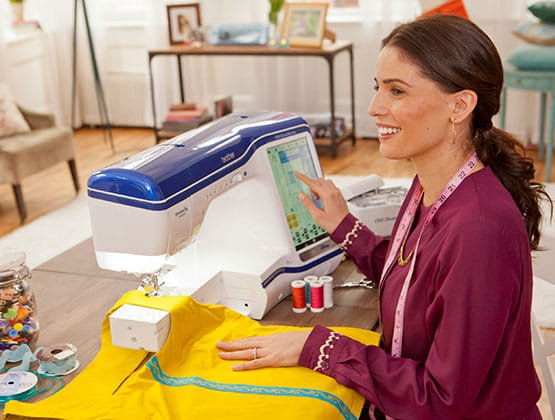 Woman using a Brother sewing and embroidery machine