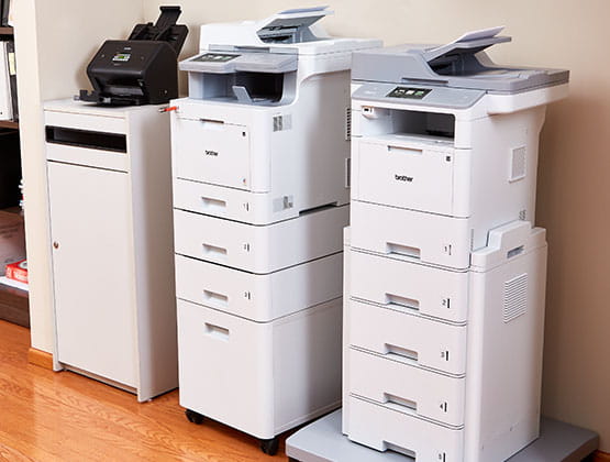 ADS-3600, MFC-L9570CDW and MFC-L6900DW printers in alcove