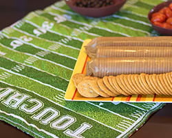 Football field table runner with snacks on top