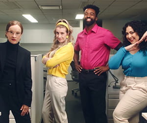 The Cartridge Family posing in an office.